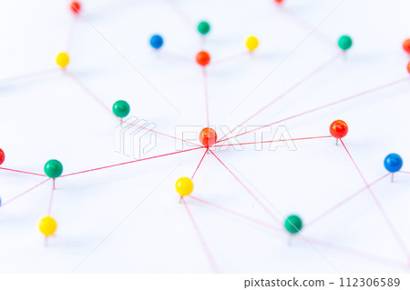 Linking entities, Blockchain, social media, Communications Network, The connection between the two networks. Network simulation on paper linked together by yarn Linking entities, Blockchain, social media, Communications Network, The connection between the two networks. Network simulation on paper linked together by yarn 112306589