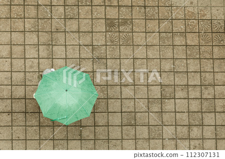 Person with umbrella. Top view Person with umbrella. Top view 112307131