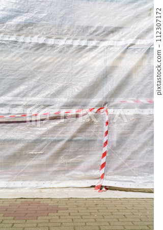 Hazard warning tape on construction site 112307172