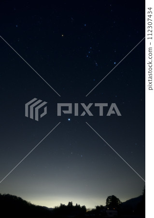 Winter stars rising in the twilight. Sirius and Orion at blue hour Winter stars rising in the twilight. Sirius and Orion at blue hour 112307434