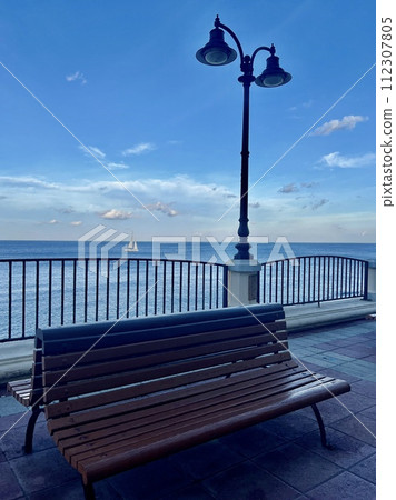 Benches and lampposts on the promenade by the sea at Sliema  Malta 112307805