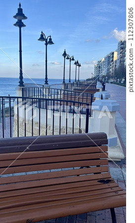 Benches and lampposts on the promenade by the sea at Sliema  Malta 112307806