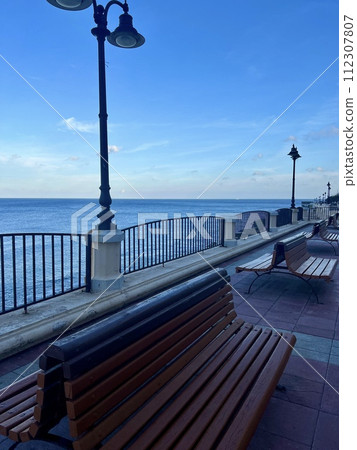 Benches and lampposts on the promenade by the sea at Sliema  Malta 112307807