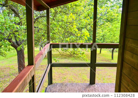 Small house cabin shed. Cute summer cabin in rural orchard. Close-up 112308428