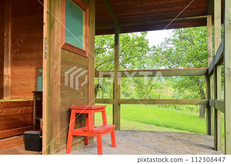 Small house cabin shed. Cute summer cabin in rural orchard. Close-up 112308447