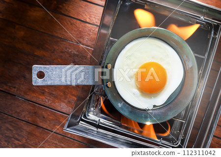 Fried eggs made outdoors and camping Fried eggs made outdoors and camping 112311042