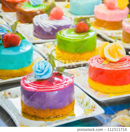 Illustration of colorful cakes lined up AI image 112311710