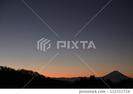 The morning star shines over the forest near dawn 112311719