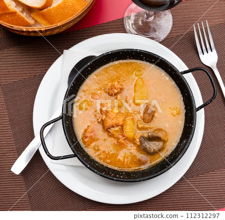 Portion of veal fillet with mushrooms cooked in large amount of fragrant gravy. Portion of veal fillet with mushrooms cooked in large amount of fragrant gravy. 112312297