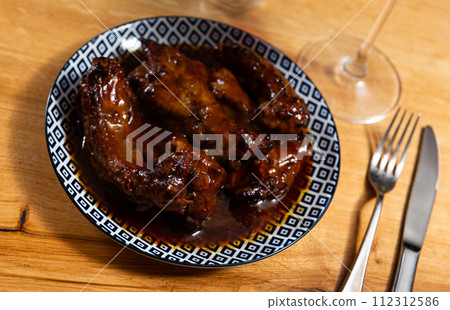 Appetizing delicious fried pork ribs on plate. Nutritious lunch Appetizing delicious fried pork ribs on plate. Nutritious lunch 112312586