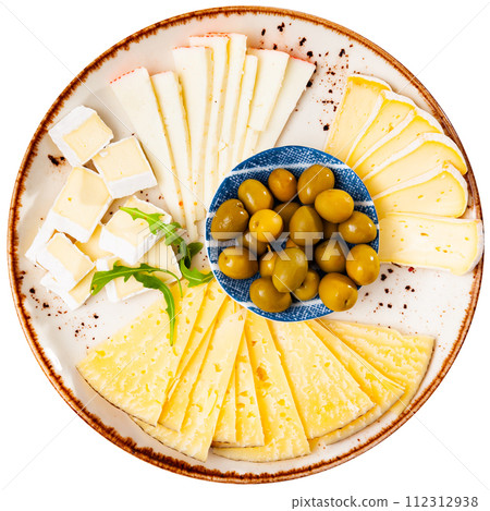 Assorted cheeses served with olives on platter Assorted cheeses served with olives on platter 112312938