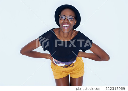 Fashion, laugh and portrait of black woman on a white background in trendy, stylish and casual clothes. Confidence, hipster style and isolated person with smile, glasses and happiness in studio Fashion, laugh and portrait of black woman on a white background in trendy, stylish and casual clothes. Confidence, hipster style and isolated person with smile, glasses and happiness in studio 112312969