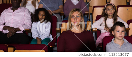 caucasian family sitting at premiere in theatrical hall caucasian family sitting at premiere in theatrical hall 112313077