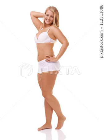 Portrait, smile and underwear with body positive woman in studio isolated on white background for wellness. Skincare, natural and plus size with proud young model looking confident in cosmetics Portrait, smile and underwear with body positive woman in studio isolated on white background for wellness. Skincare, natural and plus size with proud young model looking confident in cosmetics 112313086