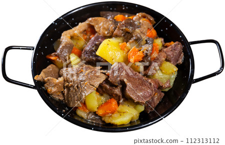 There is portion of hearty lunch on table - veal with stewed vegetables and mushrooms There is portion of hearty lunch on table - veal with stewed vegetables and mushrooms 112313112