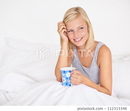 Happy woman, relax and thinking in bed with coffee and wake up with ideas for morning or future. Healthy, mindset and girl with tea in bedroom on holiday, vacation or wellness from rest in apartment 112313346