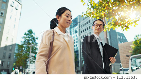 Walking, conversation and business people in the city talking for communication or bonding. Smile, discussion and professional Asian colleagues speaking and laughing together commuting in town. Walking, conversation and business people in the city talking for communication or bonding. Smile, discussion and professional Asian colleagues speaking and laughing together commuting in town. 112313633