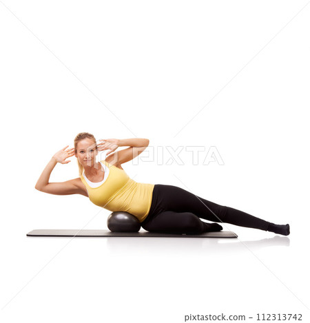 Woman, portrait and crunch with exercise ball on side for abductor workout, mockup space or white background. Female person, face and equipment in studio for training, balance or abdomen wellness 112313742