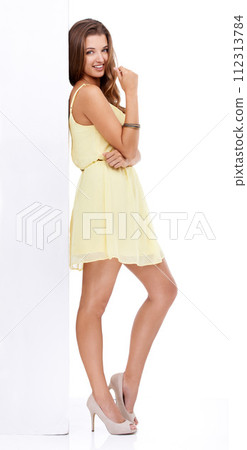 Model, portrait or fashion billboard space on white background for discount promotion in studio. Smile, news or happy woman with style or empty mockup for advertising, presentation or clothes deal 112313784