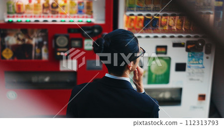 Vending machine, business man and thinking, decision or choice of automatic service on digital tech at night in city outdoor. Back, shopping and professional customer in urban town in Tokyo Japan Vending machine, business man and thinking, decision or choice of automatic service on digital tech at night in city outdoor. Back, shopping and professional customer in urban town in Tokyo Japan 112313793