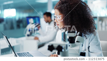 Laptop, woman or scientist with microscope or research in lab for chemistry report or medical test feedback. Bacteria, person typing or science update for online medicine development news on website 112313875
