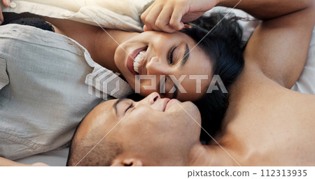 Happy couple, relax and bed for morning, romance or love in embrace, trust or care above at home. Young man and woman smile lying in bedroom rest for intimacy, passion or bonding together at house Happy couple, relax and bed for morning, romance or love in embrace, trust or care above at home. Young man and woman smile lying in bedroom rest for intimacy, passion or bonding together at house 112313935