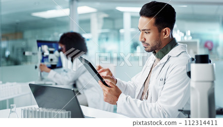Scientist, man and tablet for laboratory research, DNA analysis and results in medical study at night. Young science expert or people in biotechnology, digital software or computer for test checklist 112314411