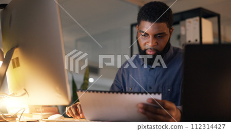 Businessman, paper and thinking in office for planning, budget and ideas at night for overtime. Man, notebook and technology in workplace with report, research and information for deadline at job 112314427