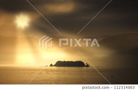 Ocean, sunset and clouds in evening with mountains, water and waves in lake. Travel, destination and vacation for summer beach or island, landscape and environment for holiday journey with sunshine Ocean, sunset and clouds in evening with mountains, water and waves in lake. Travel, destination and vacation for summer beach or island, landscape and environment for holiday journey with sunshine 112314863
