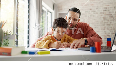 Father, boy child and homework with laptop, writing and helping hand for education, childhood development or care. Man, dad and male kid with home school, notebook and computer with teaching at desk 112315109