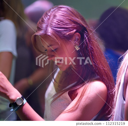 Woman, happy and dancing at party or club, smiling and entertainment at special event on weekend. Female person, joy and freedom at concert on vacation or holiday, celebrating and music festival 112315219
