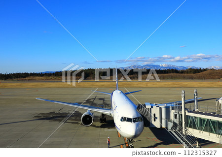Akita Airport Passenger plane and Ou Mountains 112315327