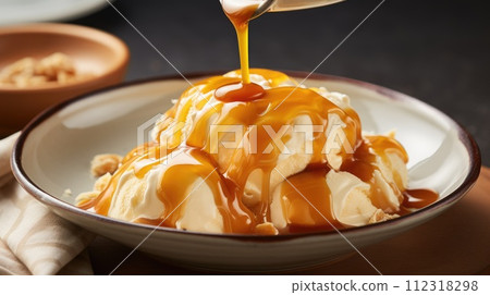 Indulge in the heavenly combination of vanilla ice cream and luscious caramel syrup, a dessert masterpiece, Ai Generated. 112318298