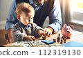 Families teach their children about money for their future 112319130