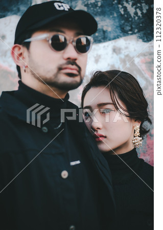Young couple standing in front of street art Young couple standing in front of street art 112320378
