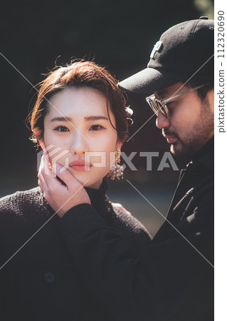 man putting hand on woman's face man putting hand on woman's face 112320690