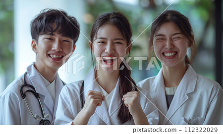 Young nurse team fist pumping 112322029