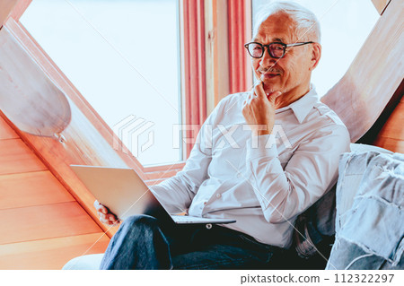Photo of a senior man doing telework Photo of a senior man doing telework 112322297