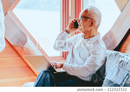 Photo of a senior man working from home Photo of a senior man working from home 112322322