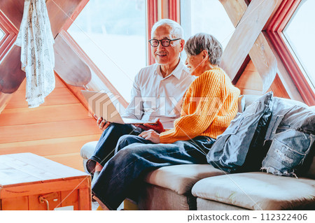 A picture of a senior couple doing a video call A picture of a senior couple doing a video call 112322406
