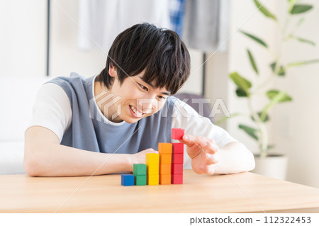 A young man thinking about asset management 112322453