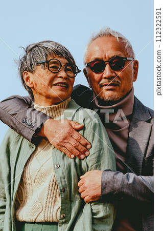 Photo of senior couple's physical contact outdoors 112322591