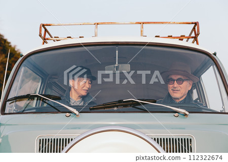 A picture of a senior couple driving 112322674