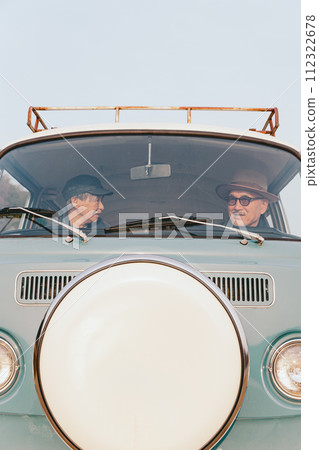 A picture of a senior couple driving 112322678