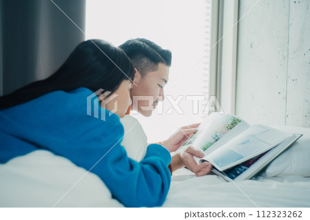 couple spending holiday in room 112323262