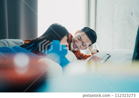 couple spending holiday in room couple spending holiday in room 112323273