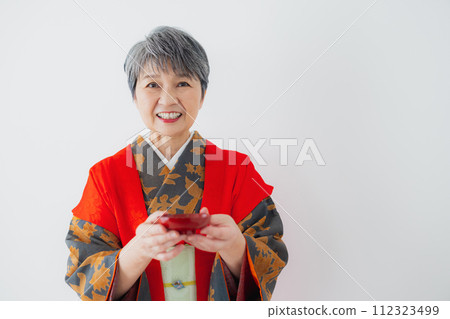 Senior woman in kimono 60th birthday celebration 112323499