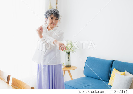 Senior woman stretching Senior woman stretching 112323543