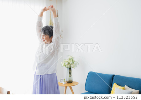 Senior woman stretching 112323552