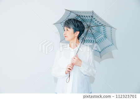 Senior woman sunblind Senior woman sunblind 112323701